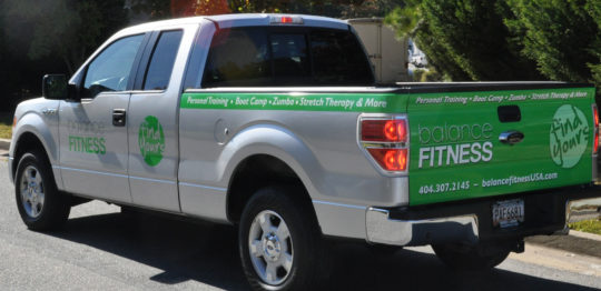 Balance Fitness corporate wrap with tailgate, side logos, lettering, and hood logo.
