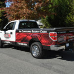 CagedN corporate wrap with custom graphics, lettering, and logos