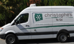 Christophe's togo corporate van wrap with side logos and lettering