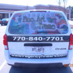 Fine Art and Frame corporate van wrap with custom graphics, lettering, and windows.