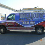 Welon's comfort heating and A/C van wrap with logos, lettering, and windows.