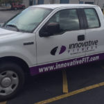Innovative Fitness half wrap with windows and lettering.
