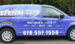 Steam TEc corporate van wrap with lettering, windows, and logos.