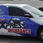 tramites xpress insurance corporate with windows, logos, and lettering.