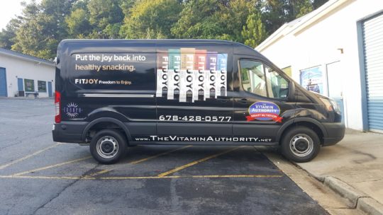 Vitamin Authority simplist corporate wrap with lettering, graphics, and side logos.