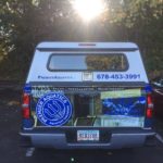 Premier Aquatics corporate wrap with sides logos, hood logos, and lettering