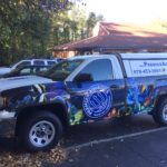 Premier Aquatics corporate wrap with sides logos, hood logos, and lettering