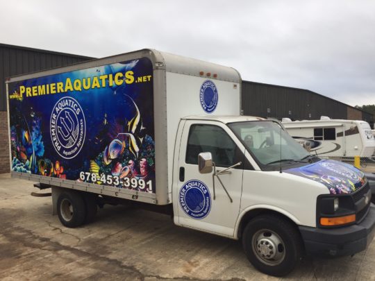 Premier Aquatics trailer truck wrap with side/hood logos and lettering