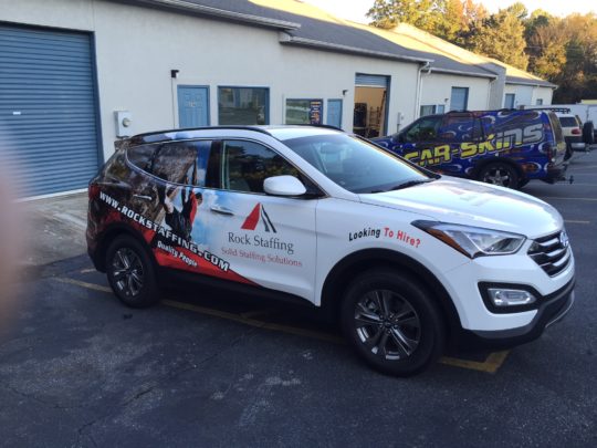 Rock Staffing corporate half wrap with side lgos, lettering, and custom graphics
