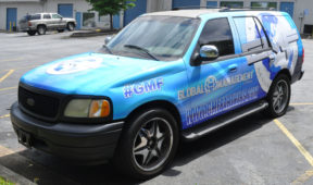 Global Managment Frim corporate wrap with hood logos, sides logos, windows, and lettering.